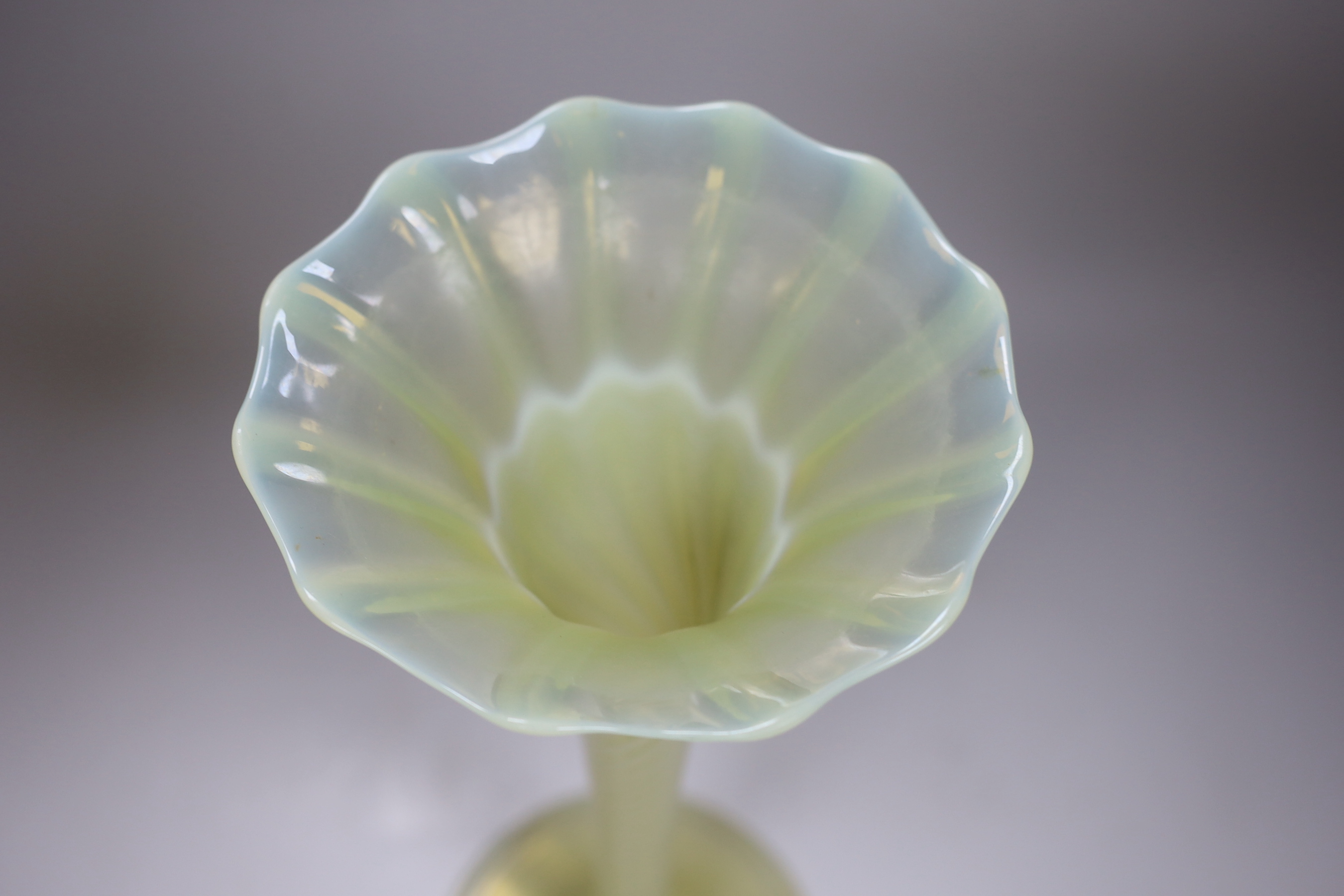 An early 20th century Vaseline glass vase, 41cm tall